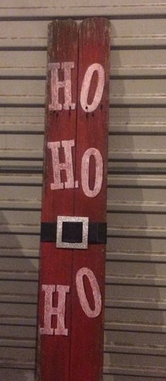 a wooden sign that says ohoh with santa's hat on it and the words