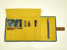 "Carry your writing tools with you in our cool roll-up pencil case. With capacity for a notebook and 5 pen holders plus a zipper compartment for small items. Throw it in your bag and go for the adventure. Open it and have it all ready at a glance. This cool pencil case will allow you to carry a notepad, pens and some small items in a Lots of stationery to carry? no problem, we have the bigger version of this case, check it here: https://www.etsy.com/es/listing/661083855/estuche-rollup-roll-up-al Cheap Leather Pencil Case For Daily Use, Portable Leather Pencil Case, Portable Leather Rectangular Pencil Case, Functional Pencil Case With Removable Pouch For On-the-go, Leather Rectangular Pencil Case With Pen Holders, Roll Up Pencil Case, Cool Pencil Cases, Canvas Pencil Case, Roll Up