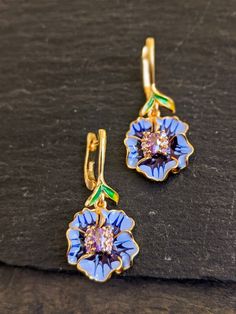 Exquisite enamel details flower dangle pure silver earrings with eye catching enamel details enhanced with lavender stones Length: 1.5 Inches Elegant Flower Shaped Enamel Earrings, Multicolor Flower Enamel Earrings, Silver Flower-shaped Enamel Earrings, Purple Flower-shaped Pierced Earrings, Luxury Flower-shaped Enamel Earrings, Lavender Stone, Earring For Women, Purple Orchids, Party Jewelry