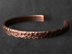 Description: 🌟 Unleash your bold style with our Hammered Solid Copper Metal Bracelet! A stunning blend of rustic charm and Viking-inspired craftsmanship, this unisex cuff bangle is a statement piece for both men and women. 🌟 ✨ Features: Handcrafted Hammered Design: Each bracelet is individually hammered by hand, giving it a unique texture that reflects an authentic, raw look. The rustic, worn-in style adds character and depth to this bold cuff bangle. Solid Copper Construction: Made from pure Rustic Adjustable Bangle Cuff Bracelet, Rustic Handmade Cuff Bracelets, Rustic Cuff Bracelets Handmade, Adjustable Rustic Bangle Cuff Bracelet, Rustic Adjustable Bronze Bracelets, Rustic Cuff Bracelets As Gift, Adjustable Rustic Bronze Bracelets, Handmade Rustic Cuff Bracelet, Rustic Adjustable Bronze Bracelet