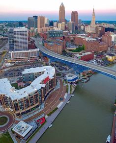 an aerial view of a city with bridges and buildings