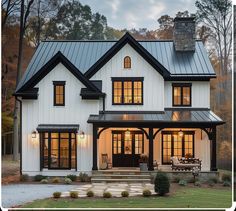 a white house with black trim and windows