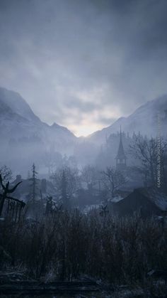 an image of a foggy mountain landscape with houses and trees in the foreground