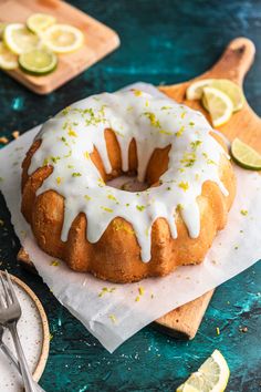 a lemon bunt cake with white icing and sprinkles