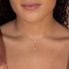 D A N G L E ∙ D I A M O N D ∙ N E C K L A C E  This dainty diamond necklace will add an exquisite sparkle to any outfit. The delicate chain features an easy-to-wear dangle design, showcasing a diamond pendant that is designed to look like it is floating along the delicate fine chain. With its minimal chain, this necklace is ready to take you from day to night with effortless elegance. * Material: High Quality Solid 925 Sterling Silver  * Finish: Sterling Silver ∙ 18K Gold  * Featuring a round CZ Dainty Gold Drop Necklace, Delicate Dangle Charm Necklaces, Dainty Drop Necklace With Clavicle Chain, Minimalist Charm Necklace With Delicate Dangle Chain, Minimalist Dangle Charm Necklace With Delicate Chain, Minimalist Charm Necklaces With Delicate Dangle Chain, Minimalist Dangle Drop Necklace With Clavicle Chain, Dainty Drop Necklace For Everyday, Minimalist Clavicle Chain Drop Necklace