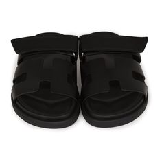 This pair of Cypre sandals are in Black calfskin and feature the iconic H and a velcro crossover strap. Origin: ItalyCondition: New and never wornAccompanied by: Hermes box, dustbags, ribbonSize: 34.5 EU Black Slip-on Sandals With Tang Buckle, Luxury Double Strap Sandals With Tang Buckle, Modern Black Slides With Buckle Closure, Designer Double Strap Leather Sandals, Luxury Double Strap Calf Leather Sandals, Luxury Black Mules With Buckle Closure, Black Calf Leather Sandals With Leather Footbed, Luxury Sandals With Double Strap And Branded Insole, Luxury Black Sandals With Tang Buckle