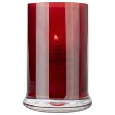 a red candle with white and silver stripes on the bottom is in front of a white background