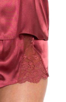 Fall in love completely with this satin cami and matching shorts featuring sheer lace with scalloped edges. 15 1/2" top center front length; 2" inseam, 29" leg opening; 9 1/2" front rise; 13" back rise (size Medium) Cami has V-neck; adjustable straps; racerback Shorts have elastic waist 100% polyester with 64% nylon, 19% spandex, 17% rayon lace Machine wash, tumble dry Imported Lingerie Summer Satin Bottoms With Lace Trim, Lace Camisole For Pajama Party, Lace Trim Camisole For Pajama Party, Lace Camisole With Lace Trim For Pajama Party, In Bloom By Jonquil, Short Satin, Satin Cami, Satin Pajamas, Scalloped Edges