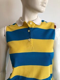 Vintage MISSONI sport by Malerba striped top. Wide stripes in yellow and blue with a white collar, very preppy/hipster sleeveless blouse.  Great for everyday summer style.  Logo on the side.  Brand - MISSONI sport by Malerba  Made in Italy  Material - cotton  Size - XS / Italian  Appr. Measurements:  ( taken when blouse lying flat, double armpit to armpit and bottom ): Shoulder to Shoulder (from seam to seam) - 14 inches / 35.56 cm Shoulder - 5 inches / 12.18 cm Armpit to armpit - 17 inches / 43 Fitted Tank Top With Contrast Stripes For Spring, Casual White Tank Top With Contrast Stripes, Fitted Tops With Contrast Stripes For Spring, Fitted Spring Tops With Contrast Stripes, Sporty Cotton Tops With Vertical Stripes, Fitted Striped Tank Top, Sporty Yellow Tops For Summer, Blue Tops With Striped Collar In Sporty Style, Sleeveless Cotton Tank Top With Contrast Stripes