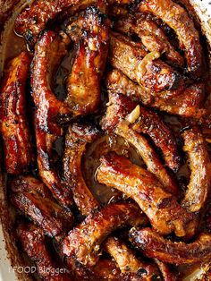 barbecued chicken wings in a pan with brown sauce