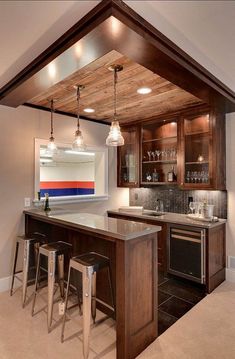 a kitchen with wooden cabinets and bar stools