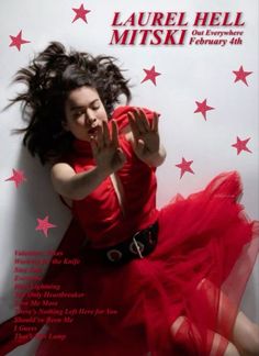 a woman in a red dress is posing on the cover of a magazine with stars around her