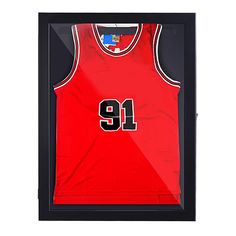 a basketball jersey hanging in a black framed display case with the number 19 on it