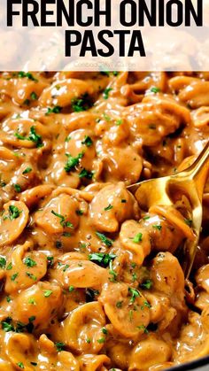 a skillet filled with chicken and mushrooms covered in gravy, garnished with parsley