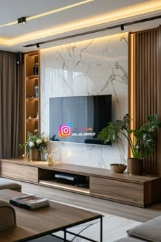 a living room filled with furniture and a flat screen tv mounted to the wall above it