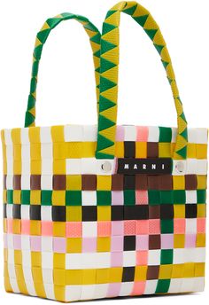 Basket-woven plastic tote in multicolor. · Fixed carry handles · Leather logo patch at face · Rivets at face and back face · Unlined · H5.5 x W5.75 x D3.5 · Total height: H9.75 Supplier color: Multicolor Multicolor Travel Bag With Logo, Multicolor Plastic Bag For Everyday Use, Multicolor Plastic Travel Bag, Playful Multicolor Bags For Shopping, Multicolor Plastic Bags For Everyday Use, Multicolor Plastic Bags For Daily Use, Playful Multicolor Shopping Bags, Basket Woven, Basket Tote