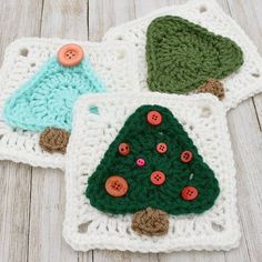 three crocheted christmas tree coasters with buttons