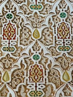 an intricately designed wall panel in the middle of a building