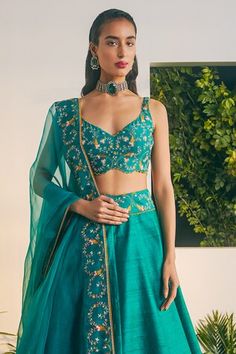 Emerald raw silk attached cancan lehenga. Paired with a emerald thread embroidered sleeveless blouse and silk organza thread embroidered dupatta. - Aza Fashions Silk Lehenga With Pallu, Sleeveless Silk Lehenga With Dupatta, Festive Sleeveless Raw Silk Choli, Festive Tissue Silk Fitted Choli, Fitted Raw Silk Choli With Sheer Dupatta, Fitted Sleeveless Raw Silk Choli, Cancan Lehenga, Raw Silk Lehenga, Green Thread