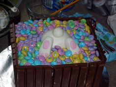 there is a cake that looks like an easter bunny in the box on the floor