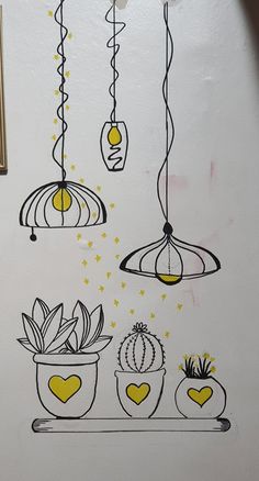 the wall is decorated with hanging plants and potted cacti in yellow, black and white