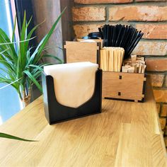 a wooden table topped with lots of different types of items on top of each other