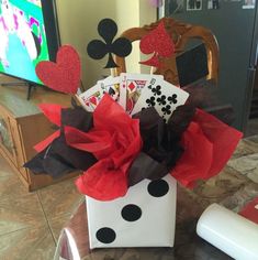 a box filled with cards sitting on top of a table next to a remote control