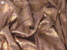 Mauve Indian Brocade Fabric Yardage Banarasi Blended Silk Bridal Wedding Dresses Lengha DIY Crafting Sewing Drapery Upholstery Costumes. This is a beautiful heavy benarse art silk brocade floral design fabric in Mauve and Gold. ➤Product: Brocade Fabric ➤Fabric Type: Blended Silk (Viscose and Silk) Fine quality Zari Brocade Weaving from Banaras ➤Color: Mauve and Gold ➤Width: 44 inches. ➤Condition: New ➤Code: bg2283 ➤Listing for 1 Yard of fabric. ➤Care: Dry Clean Only You can use this fabric to ma Silk Brocade Dress, Brocade Fabric Dresses Indian, Traditional Brocade Embroidered Fabric For Wedding, Unstitched Brocade Embroidered Fabric For Traditional Drape, Traditional Drape Embroidered Brocade Fabric, Unstitched Brocade Fabric With Traditional Patterns, Engagement Lehenga, Ceremonial Gold Brocade Embroidered Fabric, Silk Satin Fabric