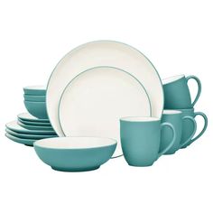 a set of blue dishes and cups with white rims on the top, in front of a white background