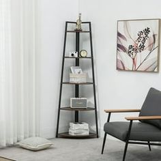 a living room with a chair, book shelf and pictures on the wall above it