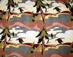 an image of birds flying in the sky with trees and clouds printed on it's fabric