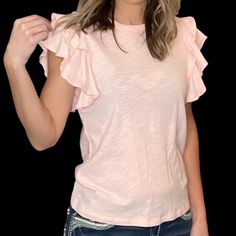 Add A Little Flattery To Your Style With This Super Cute, Flirty, Pale Pink Tee! This Tee Features A Little Romantic Flouncy Ruffle On Its Sleeve. Love Them Or Hate Them, Ruffles Are In! Description: Self: 100% Cotton Total Length: 25" | Bust 17 1/2" | Shoulder 13" Spring Ruffled Tops For Brunch, Spring Brunch Tops With Ruffles, Ruffled Cotton Short Sleeve Top, Cotton Short Sleeve Top With Ruffle Sleeves, Feminine Flutter Sleeve Top With Ruffle Hem, Ruffle Sleeve Cotton Top With Ruffles, Ruffle Sleeve Tops With Ruffles For Brunch, Cotton T-shirt With Ruffles And Flutter Sleeves, Ruffle Hem And Sleeve Tops For Day Out