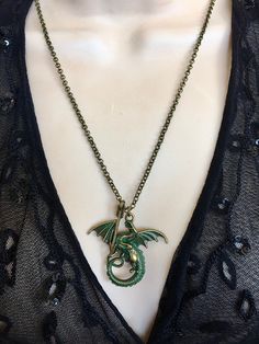 "Brass Dragon Necklace , Flying Dragon Necklace, Dragon Pendant, Medieval Necklace Gothic Dragon Necklace This Necklace features a Bronze Arrow and a Winged Dragon with Verdigris finish. 💜Also available as a Keychain The Keyring is approximately 32mm. Necklace is 20\" long. All metal components are antiqued bronze plated. ♥ My shop can be found here: https://www.etsy.com/shop/PenelopesPorch ♥ Thanks so much for stopping by. Feel free to contact me with any questions. ♥ Arrives in a gift bag rea Collar Verde, Jade Necklace Pendant, Black Cat Necklace, Medieval Necklace, Gothic Dragon, Bronze Dragon, Halloween Necklace, Lovers Necklace, Dragon Necklace