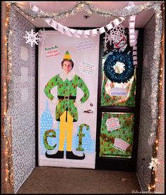 an elf door decorated with christmas lights and decorations