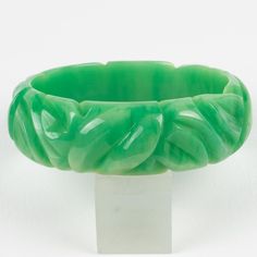 This is a gorgeous milky turquoise marble Bakelite carved bracelet bangle. It features a chunky domed shape with deep geometric carving all around. The color is an intense green marble tone with milky cloudy swirling. Measurements: Inside across is 2.63 in diameter (6.6 cm) - outside across is 3.19 in diameter (8.1 cm) - width is 0.88 in wide (2.2 cm) - The inner circumference of the bracelet is 8.16 in (20.72 cm).  Please see the measurements noted above in the description for the best approxim Green Carved Bangle Bracelets, Green Carved Bangle Bracelet, Carved Green Jade Bangle, Turquoise Marble, Green Marble, Bracelet Bangle, Bangle Bracelets, Marble, Bangles