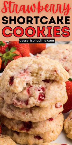 strawberry shortcake cookies stacked on top of each other with strawberries in the background