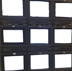 several televisions are stacked on top of each other with white screens attached to them