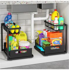 two black bins with cleaning supplies on them