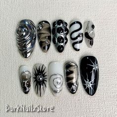 Custom Black Press On Nails, Gothic Punk Rock Nails, Snake Goth White Y2K Press On Nails bring a touch of nostalgia and futuristic style to your fingertips. With a wide range of colors, designs, and finishes, these press on nails allow you to express your individuality and stay on top of the latest trends. Whether you prefer bold and vibrant shades or subtle and sophisticated designs, DarkNailz press on nails offer endless possibilities for creating your desired look. [PLEASE READ BEFORE PURCHASING] All sets are made with GEL nail polish. These nails are reusable, if you take it off right. For instruction, please message me. Each set comes with 10 handmade press on nails, double-side gel nail glue, a mini buffer, a cuticle stick, a prep pad. 1. Measurements Please measure your own nail and Nails With Gel Designs, Dystopian Nails, Medium Length Goth Nails, Press On Nails Goth, Dark Core Nails, White Silver And Black Nails, Gothic Nails With Charms, Smokey Black Nails, Gothic Birthday Nails