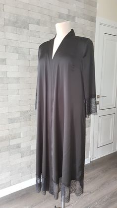 Black luxurious wedding robe, to add a perfect touch to your perfect and unique day. It can be made of high quality satin called Italian silk or natural silk. Only high quality fabrics and high finishing used for making the robe as neat as it can be. Please find the wedding robes collection here https://www.etsy.com/shop/LidiasBoutiqueDesign?ref=seller-platform-mcnav&section_id=25023222. For wedding dresses, please access https://www.etsy.com/shop/LidiasBoutiqueDesign?ref=seller-platform-mcn Elegant Satin V-neck Kimono, Elegant V-neck Robe For Evening, Elegant V-neck Kimono For Wedding, Elegant V-neck Wedding Kimono, Elegant V-neck Wedding Abaya, Elegant Lace Robe With Lace Cuffs, Elegant Wedding Robe With Lace Cuffs, Elegant Satin Dresses For Loungewear, Fitted Black Abaya For Wedding