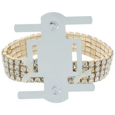 a white and gold bracelet with cross on the front, surrounded by small round diamonds