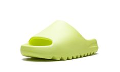 The adidas Yeezy Slide “Glow Green 2022” is a hi-vis colorway of Kanye West’s popular slip-on sandal that was released in full family sizing in May 2022.  The “Glow Green” Yeezy Slide debuted in May 2021 before returning in slightly more quantities in May 2022.  As for its design, the “Glow Green” features a neon green-colored lightweight EVA foam construction that provides optimal comfort.  The midfoot arch stabilizes the foot and the ridged outsole ensures grip on slippery surfaces.  Release d 2022 Shoes, Adidas Shoes Yeezy, Adidas Yeezy Slide, Glow Green, Yeezy Slides, Stadium Goods, Eva Foam, Adidas Yeezy, Kanye West