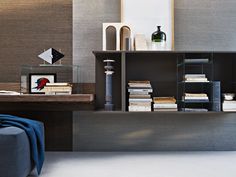 a living room filled with furniture and books