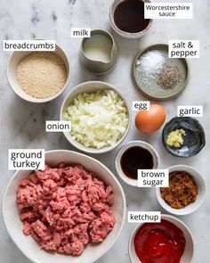 the ingredients to make this meatloaf recipe are shown in bowls on a marble countertop