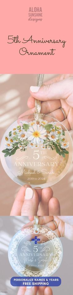 two hands holding a plate with flowers on it and the words, 50th anniversary commemorative