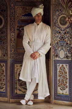 Ivory sherwani with all over geometric motif embroidery. Paired with a matching embroidered belt, a textured stole with embroidered borders, solid kurta and a co-ordinating churidar. - Aza Fashions Ivory Sherwani, Raw Silk Kurta, Embroidered Sherwani, Vacuum Storage, Indian Wedding Wear, Silk Kurta, Churidar, Modern Bride, Wedding Wear