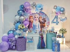 a frozen princess birthday party with balloons and decorations