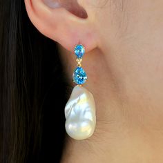 14K Solid Gold 4 Pieces 7 x 9 & 5 x 7 mm Topaz｜Swiss Blue｜Pear｜Eye Clean Topaz CTW: 6.50 Diamond Grade: G Color｜VS Clarity Diamond CTW: 0.03 Detachable Cultured Baroque Pearls Approx. 15 x 25 mm Measurements: 1 3/4 " length｜3/4 " width Convertible Features: You can wear the natural gemstones alone or with detachable pearls for a more stunning look. Our unique design allows you to MIX and MATCH with other gemstones or pearls from our convertible collections, perfect for any occasion or style! Convertible Earrings, Baroque Pearls, Natural Gemstones, Topaz, Solid Gold, Convertible, Pear, Unique Design, Emerald