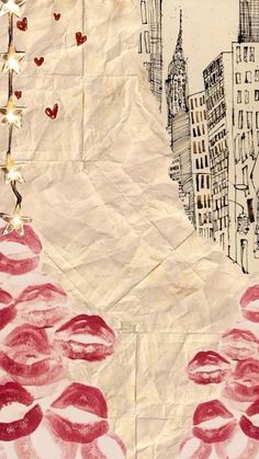 a piece of paper with red lipstick on it and buildings in the background that have hearts drawn on them