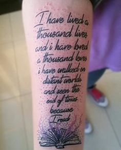 a person with a tattoo on their arm that reads, i have lived a thousand lives and i have loved a thousand loves